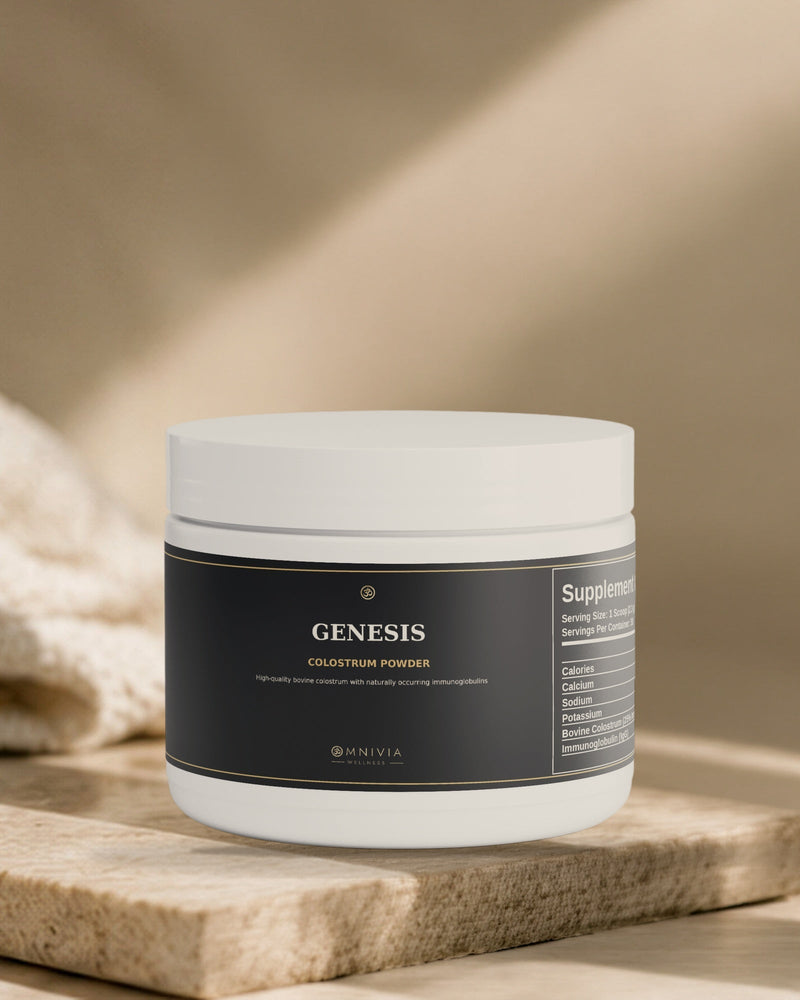 Genesis Colostrum tub standing on a travertine slab in warm directional light