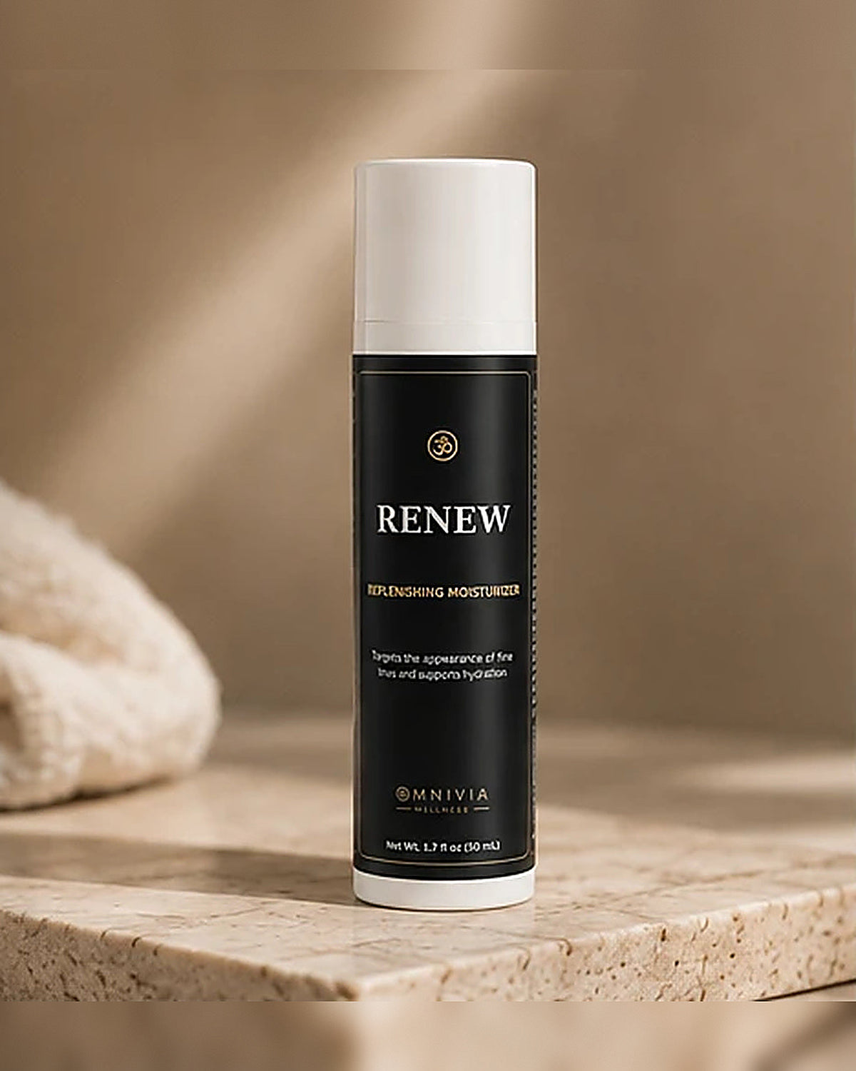 Renew Replenishing Moisturizer airless pump on a travertine ledge beside a soft towel in warm morning light
