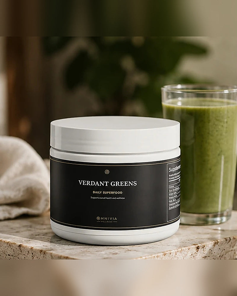 Verdant Greens tub beside a glass of green smoothie on a travertine ledge